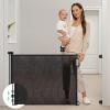 imageRetractable Baby Gate Momcozy Mesh Baby Gate or Mesh Dog Gate 33quot TallExtends up to 55quot Wide Child Safety Gate for Doorways Stairs Hallways IndoorOutdoorBlack